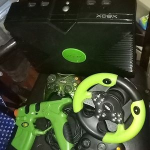I'm showing my original Xbox console and controllers, gun,and steering wheel